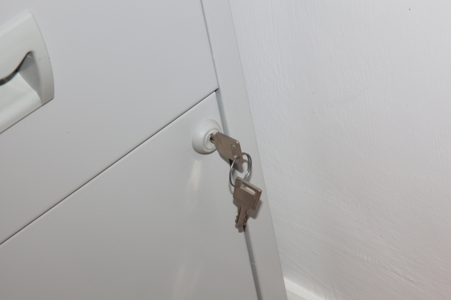 Keys in the lock of an office file cabinet