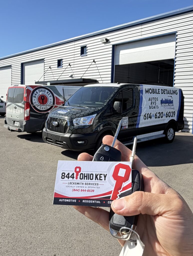Locksmith cutting a replacement car key at a detailing shop on Cemetery Road in Hilliard, Ohio