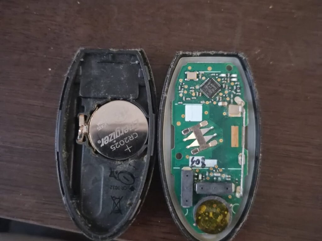 Opened 2021 Nissan Sentra key fob with the battery installed upside down
